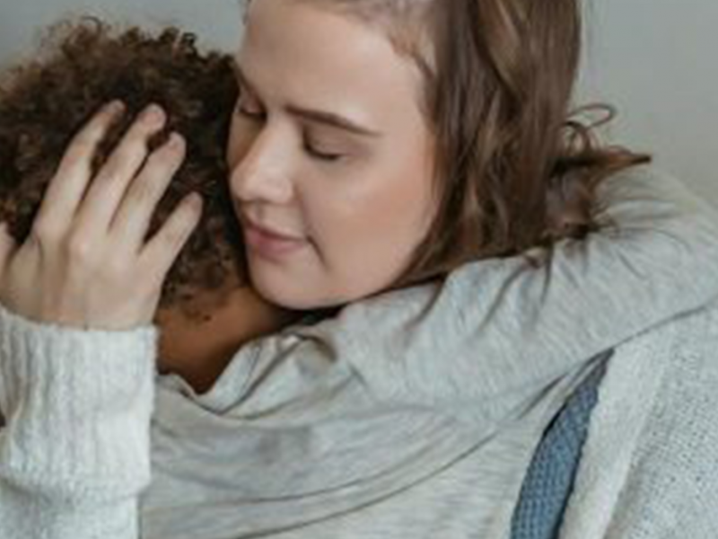 A mother hugging a child. Feature image of Rebuilding your life with your children after escaping a dangerous partner.