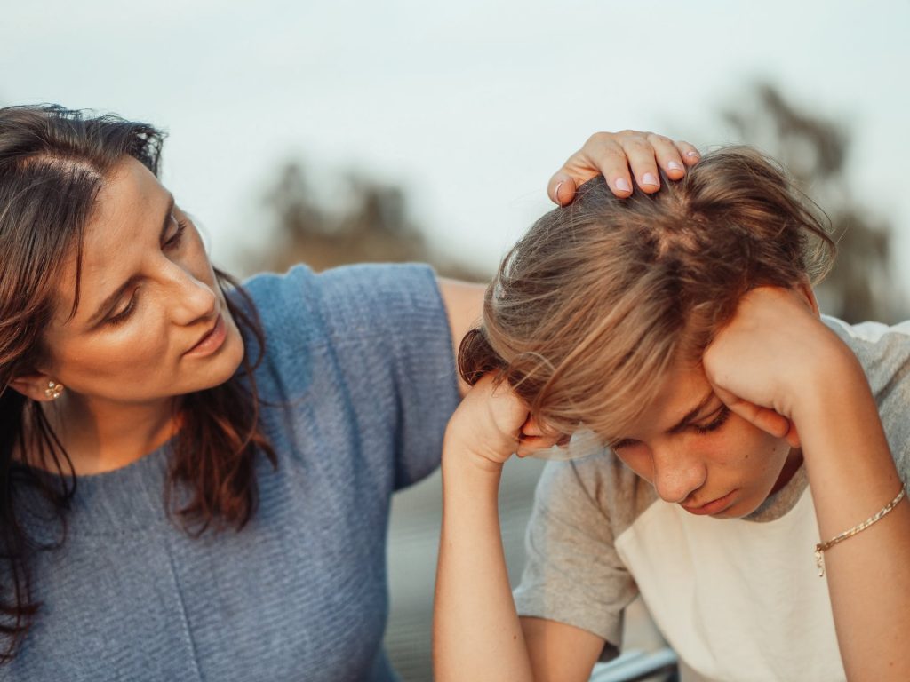 Mother consoles son