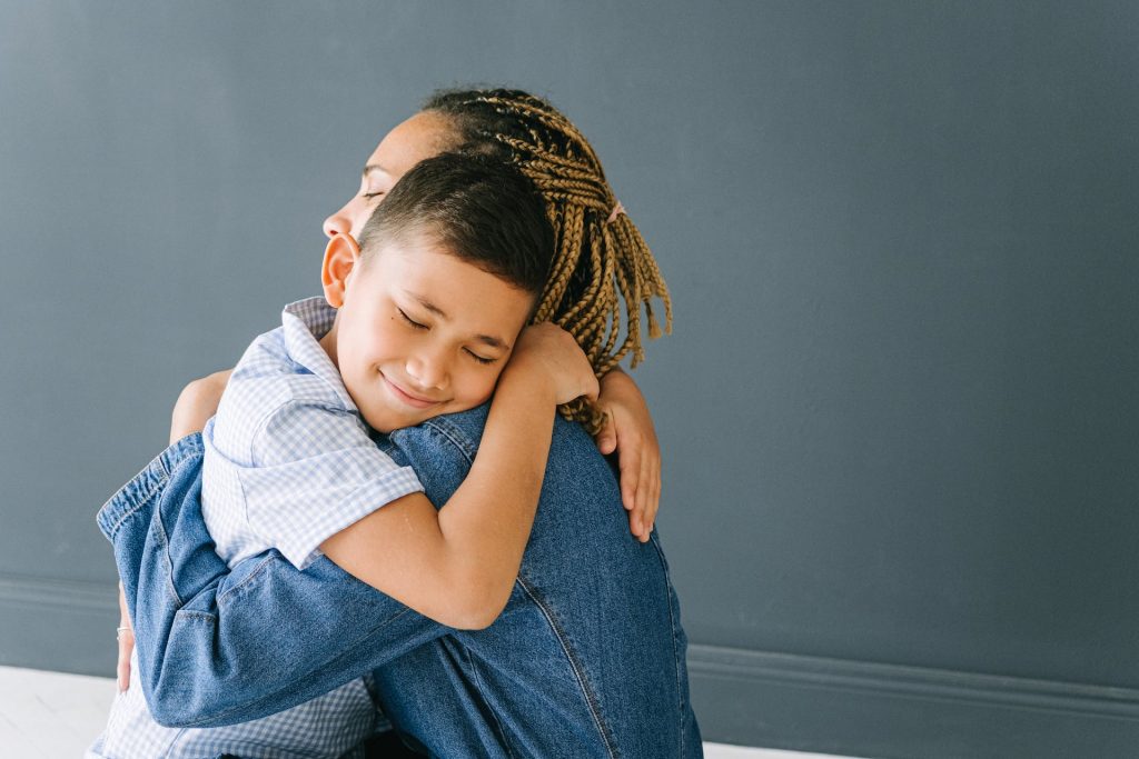 Mother hugging son