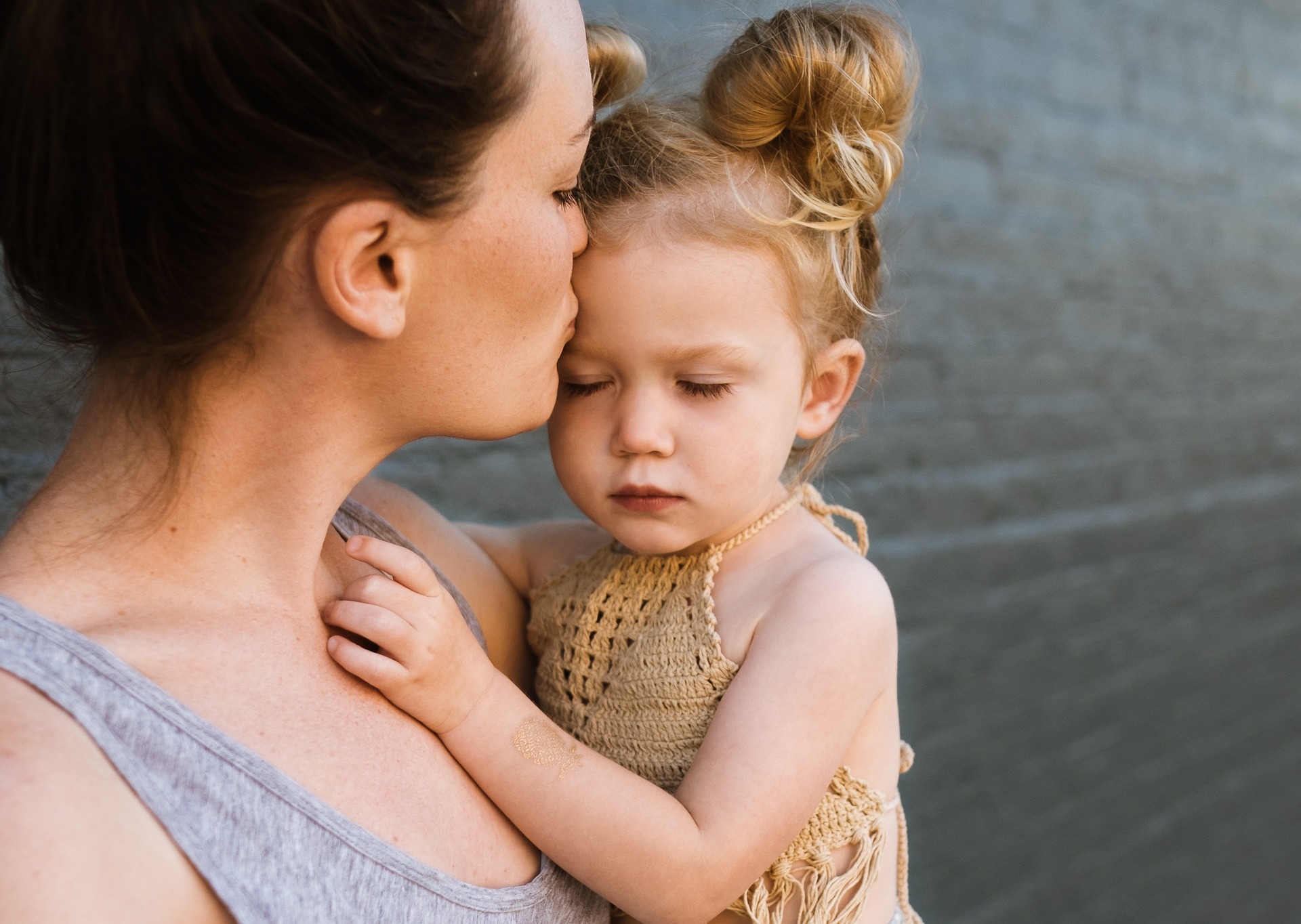 mum kissing child