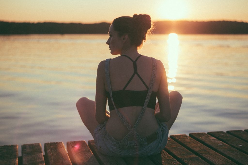 Woman looking into sunset